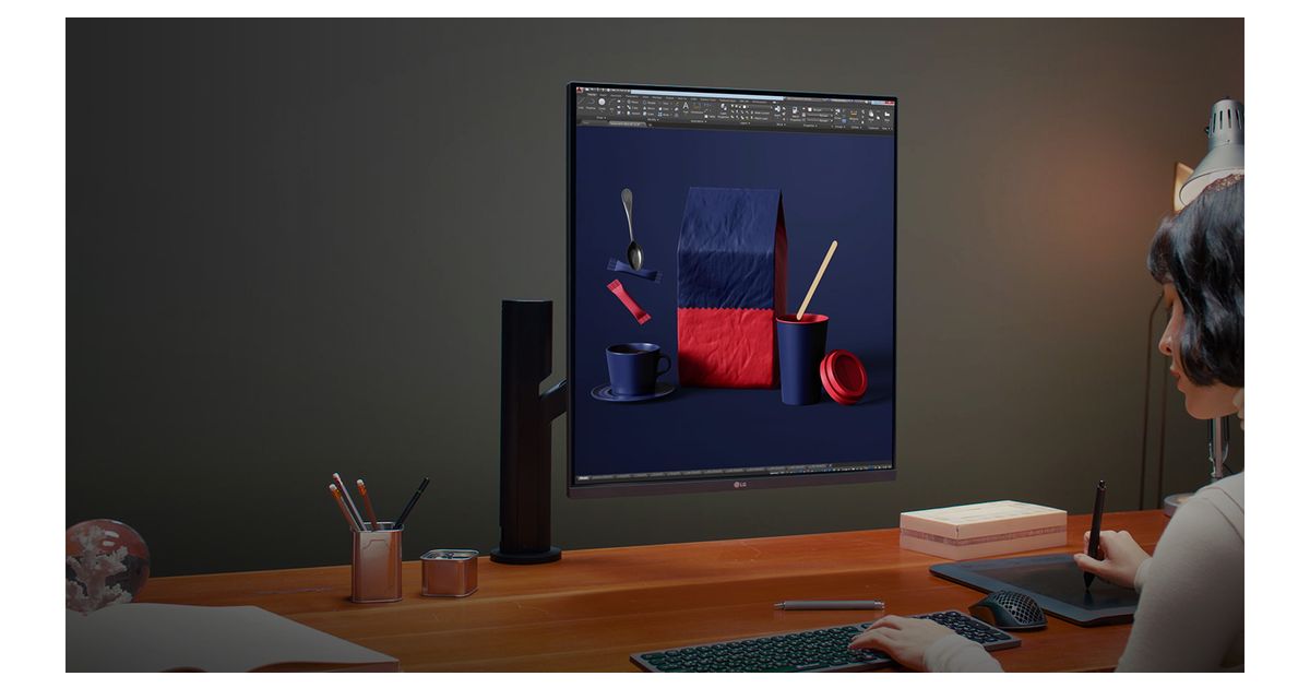 LG DualUp 28MQ780 on an ergonomic arm at a design workstation